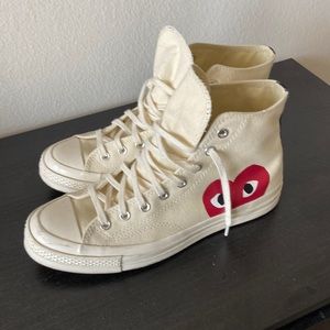Cream high top CDG chuck taylors.